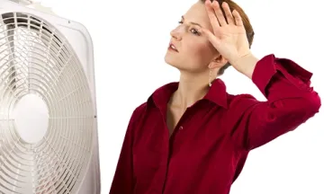 Woman wipes sweat