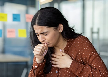 Coughing, throat irritation, wheezing, or breathlessness