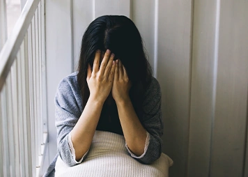 Having low self-confidence or withdrawing from social situations