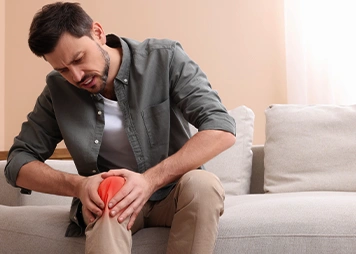 Pain or stiffness in the knee joint